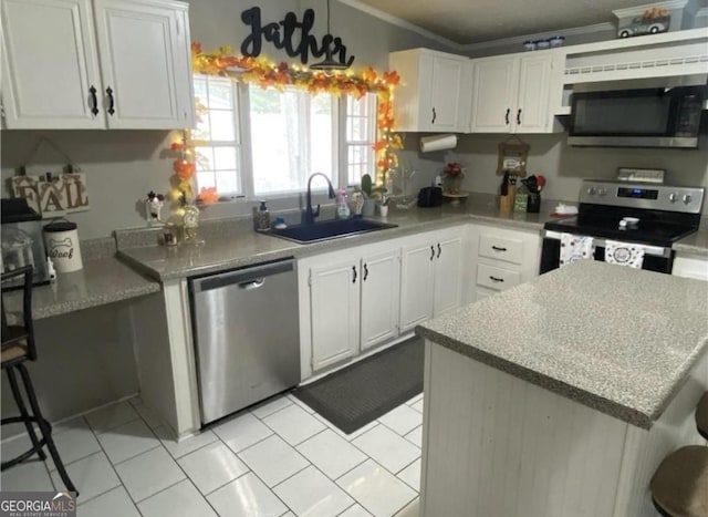 kitchen with stainless steel appliances, crown molding, sink, light tile patterned floors, and white cabinets