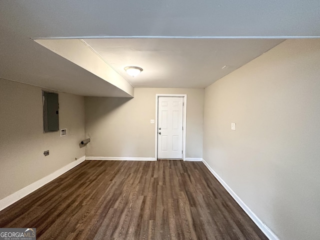 washroom with electric dryer hookup, electric panel, hookup for a washing machine, and dark hardwood / wood-style floors