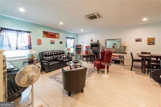 living room with light hardwood / wood-style flooring