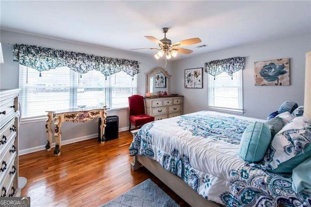 bedroom featuring ceiling fan and wood-type flooring