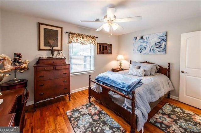 bedroom with hardwood / wood-style flooring and ceiling fan