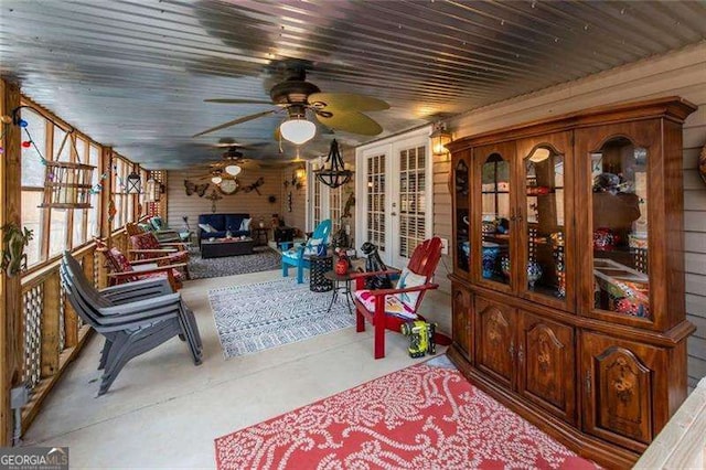 sunroom / solarium with french doors and ceiling fan