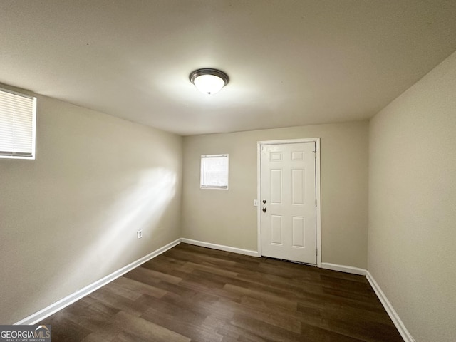 empty room featuring dark wood-type flooring