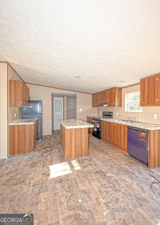 kitchen with black stove, hardwood / wood-style flooring, a textured ceiling, dishwashing machine, and a kitchen island