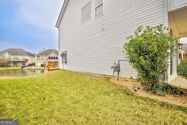 view of yard with a water view