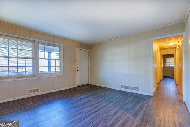 spare room with dark hardwood / wood-style flooring