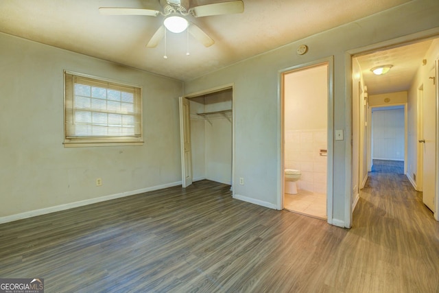 unfurnished bedroom with a closet, ceiling fan, and dark hardwood / wood-style floors