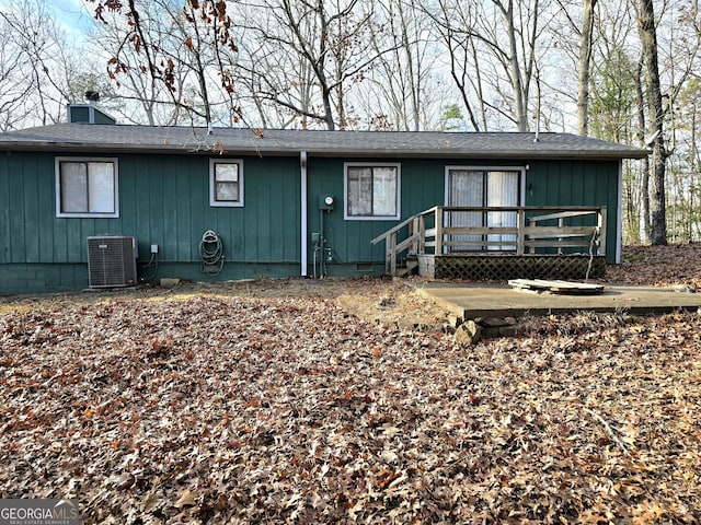 rear view of house with a deck and central air condition unit