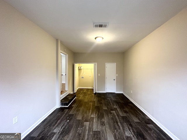 hallway featuring dark wood-type flooring