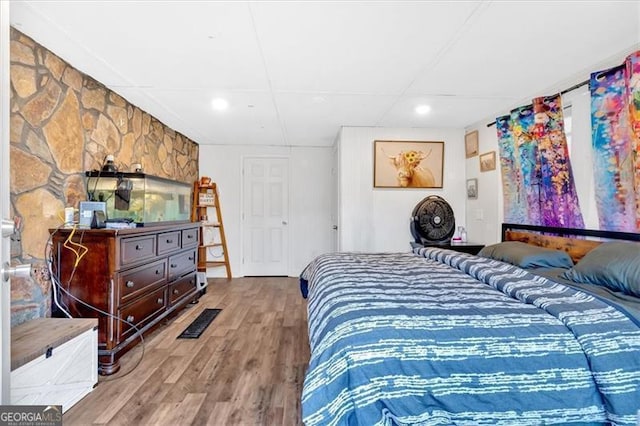 bedroom featuring wood-type flooring