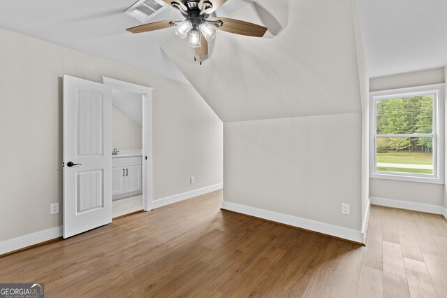 additional living space with ceiling fan, lofted ceiling, and light hardwood / wood-style flooring