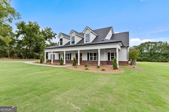 cape cod home with a front yard