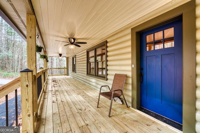 deck featuring ceiling fan and a porch