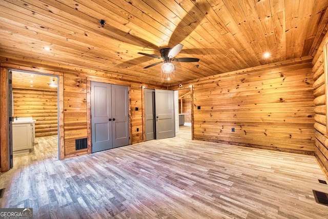 unfurnished bedroom featuring wooden ceiling, visible vents, and wood finished floors