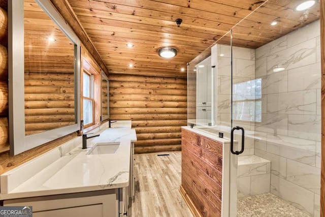 bathroom featuring rustic walls, vanity, a shower with door, wood-type flooring, and wooden ceiling