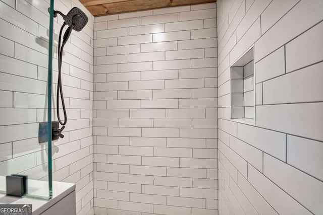 bathroom with a tile shower