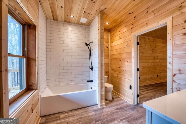 bathroom with wood ceiling, wood walls, toilet, and wood finished floors