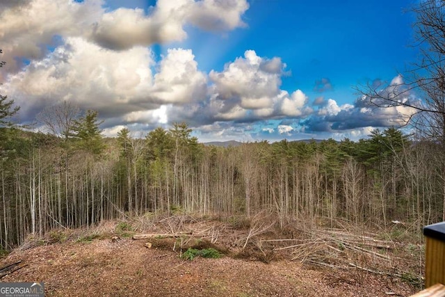 view of landscape with a view of trees