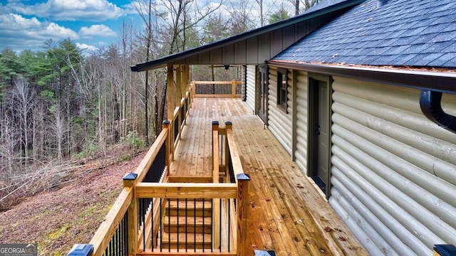 wooden terrace featuring ceiling fan