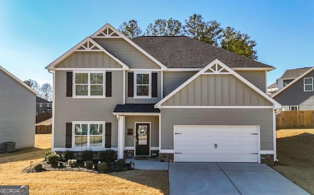 craftsman-style home featuring a front yard and a garage