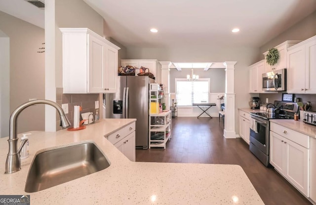 kitchen with sink, white cabinetry, and stainless steel appliances