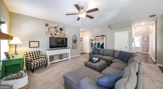 living room with carpet flooring and ceiling fan