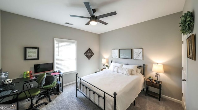 bedroom with dark colored carpet and ceiling fan