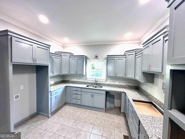 kitchen featuring light tile patterned flooring, crown molding, light stone countertops, and sink