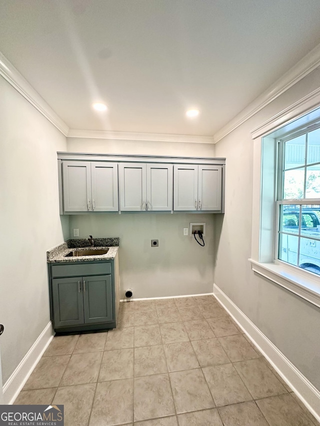 laundry room with cabinets, washer hookup, ornamental molding, electric dryer hookup, and sink