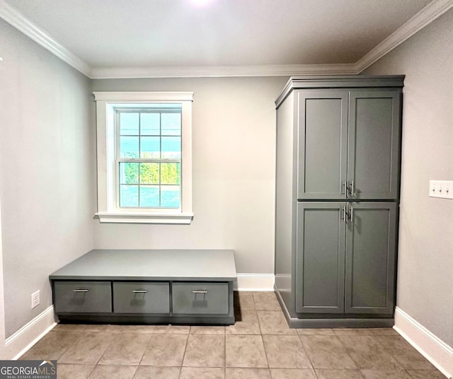 bathroom with tile patterned floors and ornamental molding