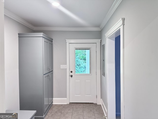 entryway with light tile patterned floors and crown molding