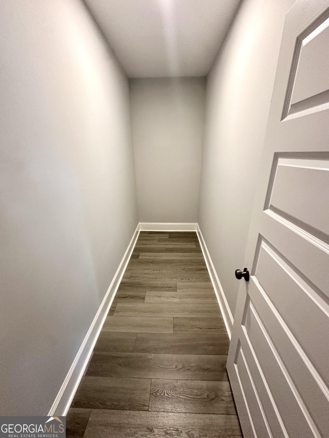 hallway featuring dark wood-type flooring