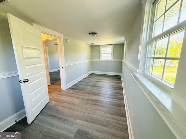 spare room featuring wood-type flooring