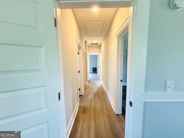 hallway with light wood-type flooring