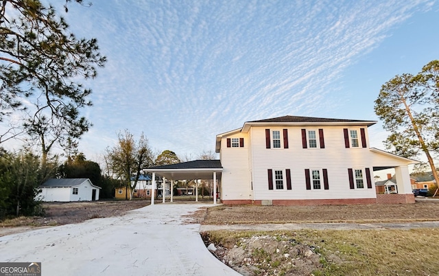 view of front of property with a carport