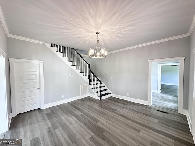 unfurnished living room featuring a chandelier, dark hardwood / wood-style floors, and crown molding