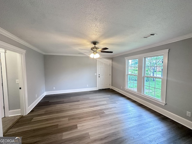 spare room featuring dark hardwood / wood-style floors, ceiling fan, and a textured ceiling