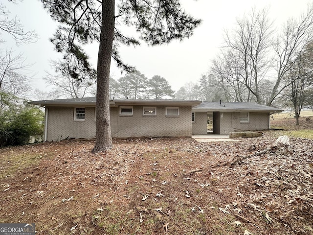 rear view of house featuring a patio