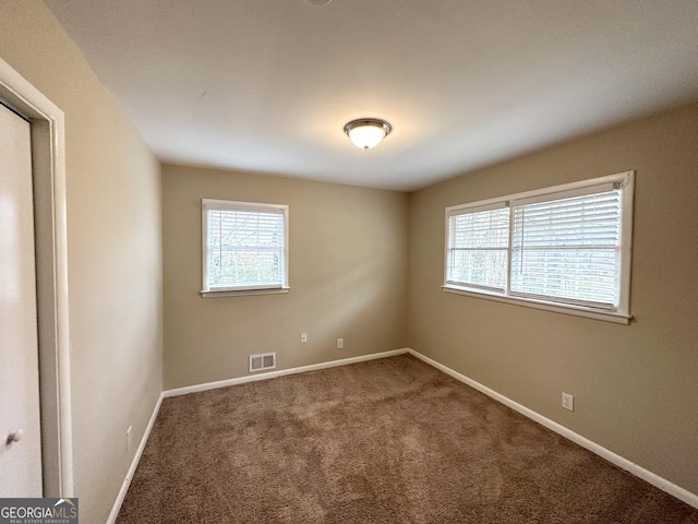 unfurnished room with carpet floors