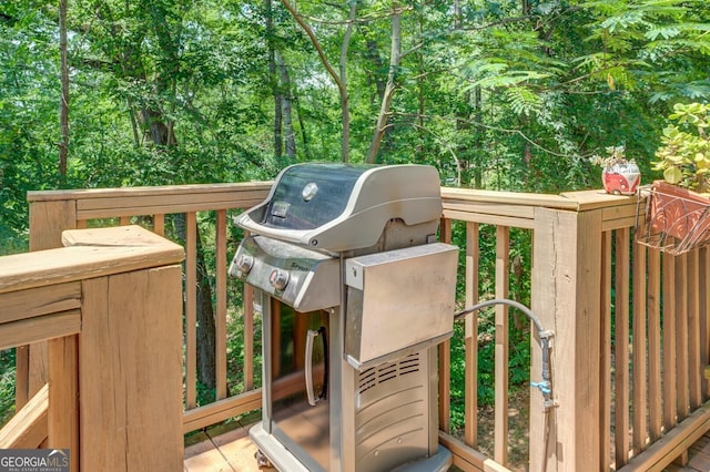 wooden deck featuring grilling area