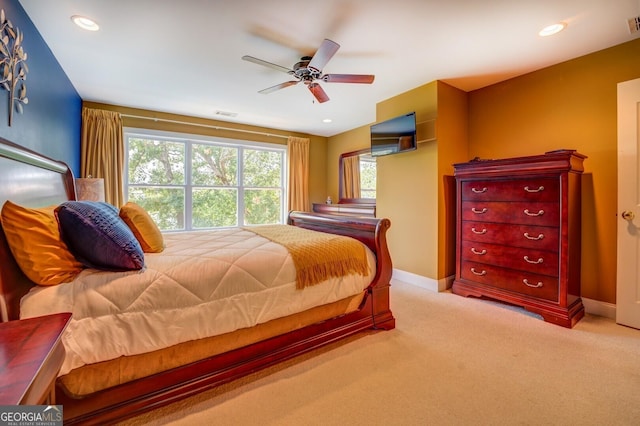 carpeted bedroom featuring ceiling fan