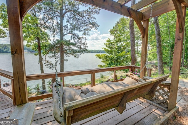 wooden deck with a water view