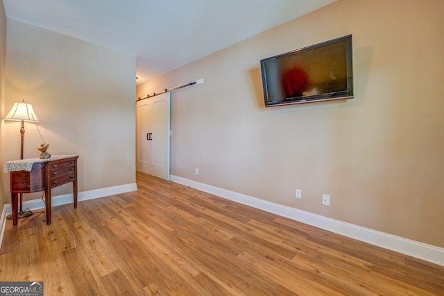 spare room featuring light hardwood / wood-style floors