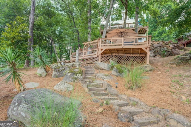 view of yard with a wooden deck