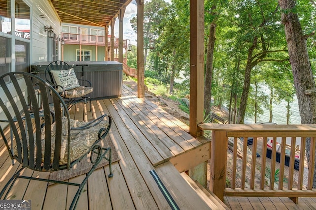 deck featuring a hot tub