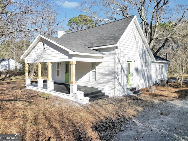 view of side of property with a porch