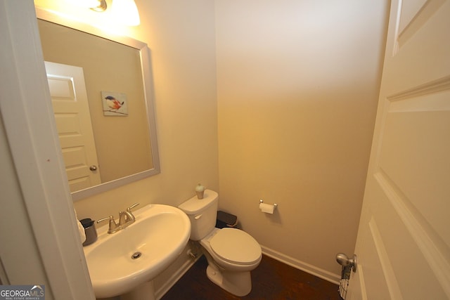 bathroom featuring sink and toilet