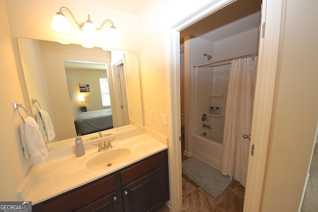 bathroom featuring shower / bath combo with shower curtain and vanity