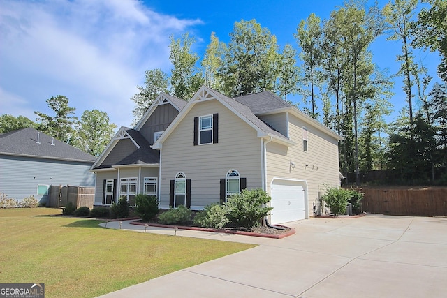 front facade featuring a garage and a front lawn