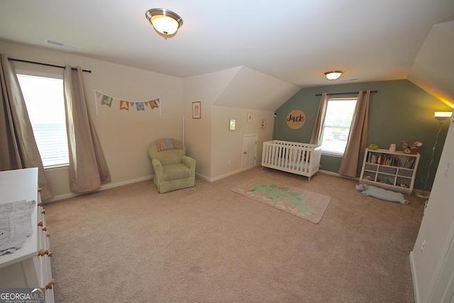 unfurnished bedroom featuring carpet flooring and vaulted ceiling